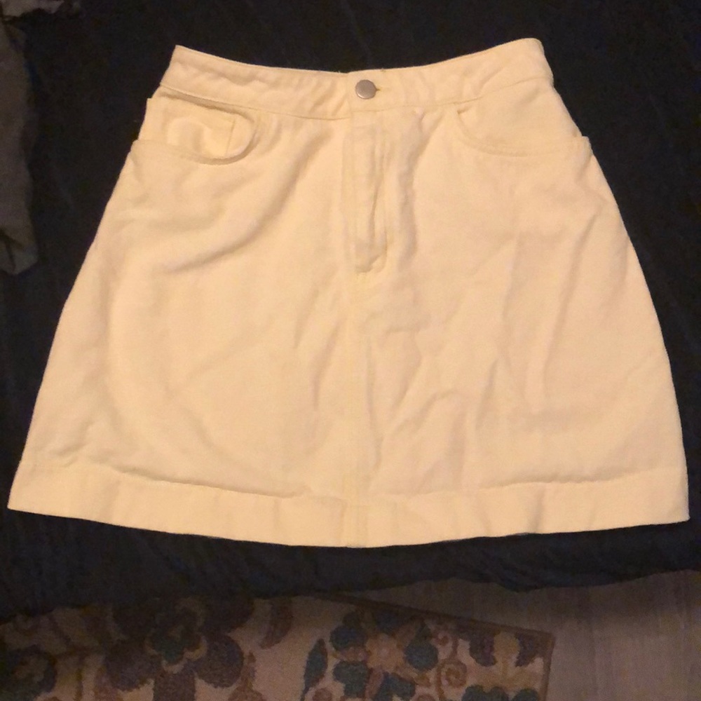 A bright yellow high waisted skirt